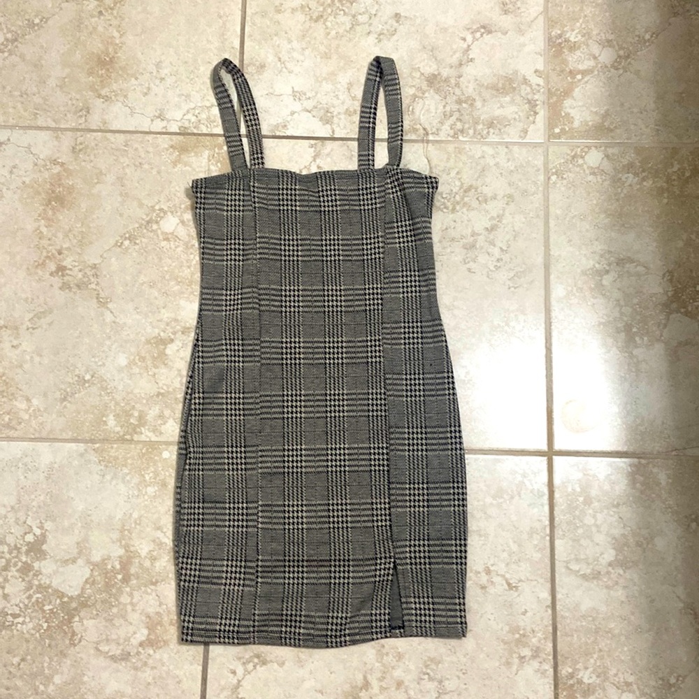 A dress with a nice pattern and has a small slot at the bottom.